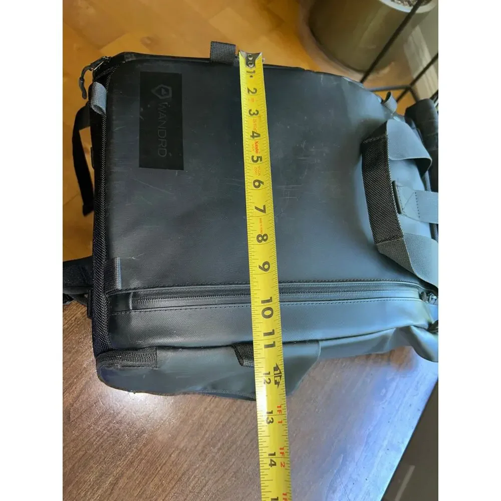 WANDRD PRVKE Lite travel camera backpack black roll-top closure magnetic handles